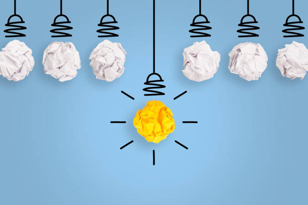 istock Creative Idea Concepts with Light Bulb Crumpled Paper on Blue Background 1226849643