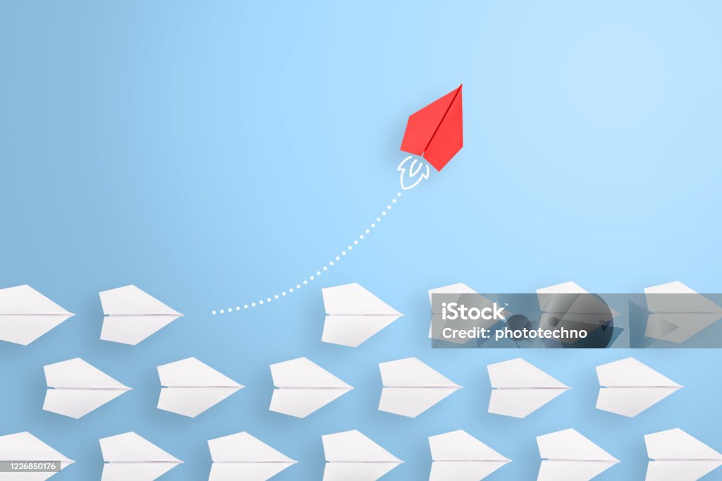 Change concepts with red paper airplane leading among white Standing Out From The Crowd Stock Photo