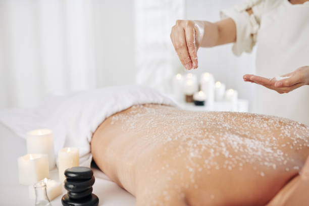 istock Beautician applying salt scrub 1226851279