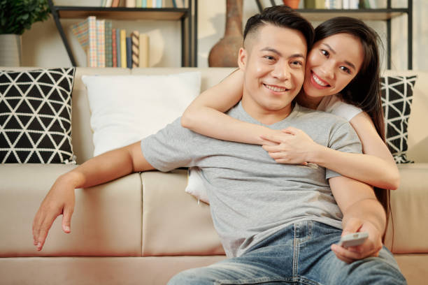 istock Couple watching game at home 1226851404
