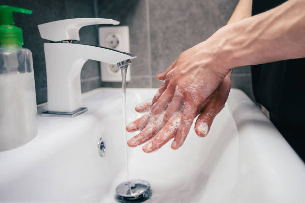 istock close up. young man is carefully soaping his hands 1226853954