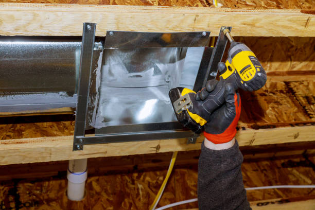 istock Worker installing air conditioner vents in new home construction 1226855951