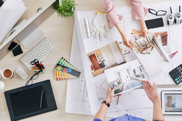 Talking designer and client Hands of interior designer and client discussing 3D renderings of rooms design new idea office stock pictures, royalty-free photos & images