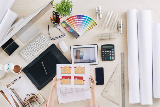 istock Architect checking images of house 1226856050