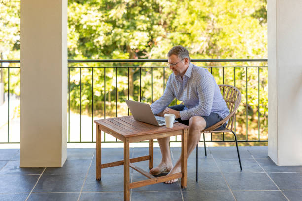 istock Casual Businessman Working From Home on his Balcony 1226857167