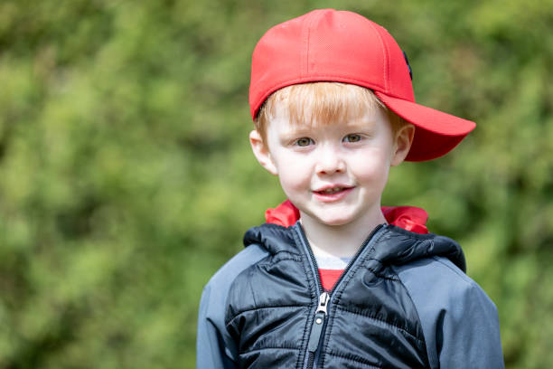 Portrait of a 3-4 years boy playing on soft nature background