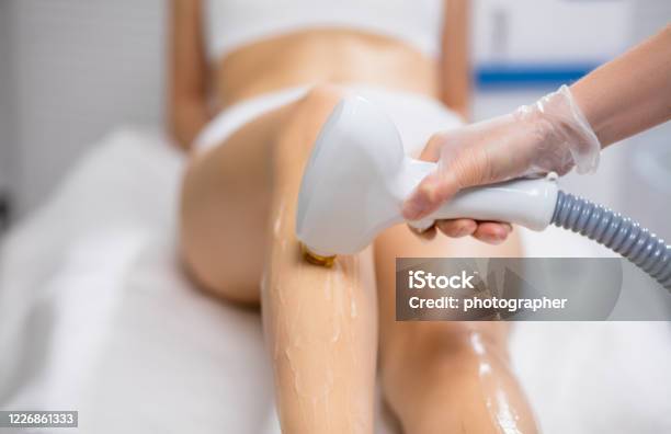 Slender Woman Get Hair Removal Procedure On Legs Stock Photo - Download  Image Now - Hair Removal, Laser, Electrolysis - iStock
