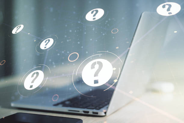 istock Creative concept of question mark illustration on modern laptop background. FAQ and search concept. Multiexposure 1226862314
