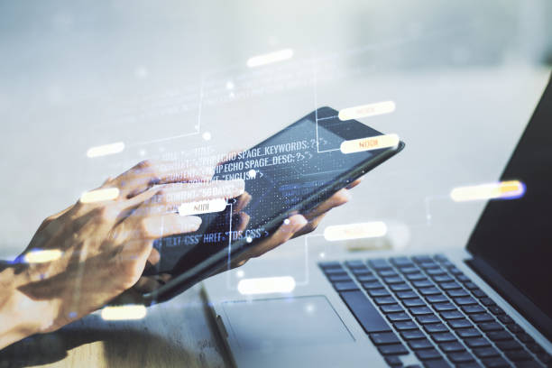 istock Multi exposure of abstract graphic coding sketch and hand working with a digital tablet on background, big data and networking concept 1226862538