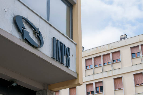 The INPS sign, the national social security institute that deals with providing pensions and collecting labor contributions, on the office building Carrara, Italy - May 24, 2020 - The INPS sign, the national social security institute that deals with providing pensions and collecting labor contributions, on the office building cristian stock pictures, royalty-free photos & images