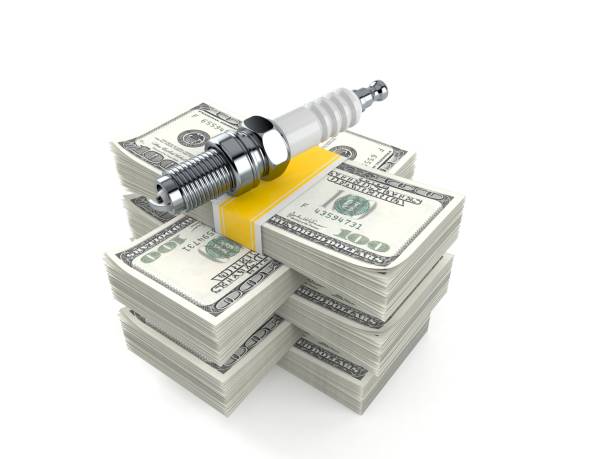 istock Car candle on stack of money 1226872523