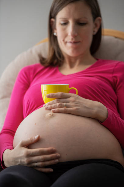 istock Pregnant young woman touching her belly 1226876191