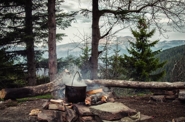 istock On the fire cauldron. Preparing food at the campsite 1226879359