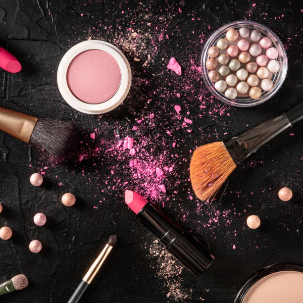 istock Professional makeup on a black background. Brushes, lipstick and other products, a square flat lay 1226879936