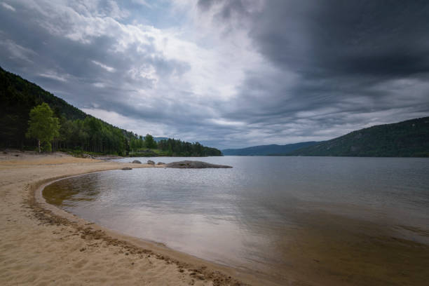 istock View over Byglandsfjorden lake from beach with dark clouds Norway 1226879971