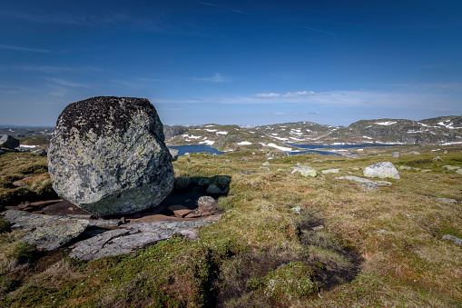 Big stone in Norwegian harsh mountain landscape