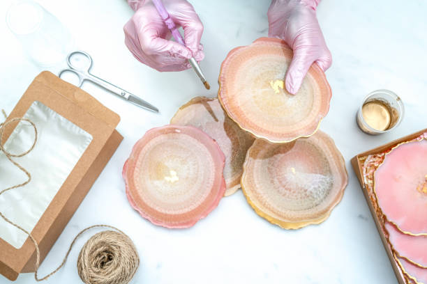 istock Creativity and craft. A young girl creates coasters from resin. Gift wrapping. Decorative packaging. Idea for business. Remote work, work at home. Art coasters. 1226880315