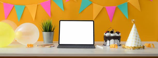 istock Online birthday party concept with blank screen tablet, cake and decorations 1226881193