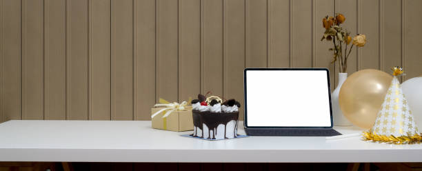istock Online birthday party concept with mock-up tablet, cake, present box and decorations 1226881251
