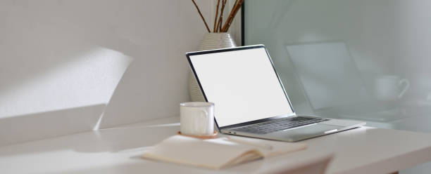 istock Modern home office desk with mock-up laptop, notebook, cup and decoration 1226881745