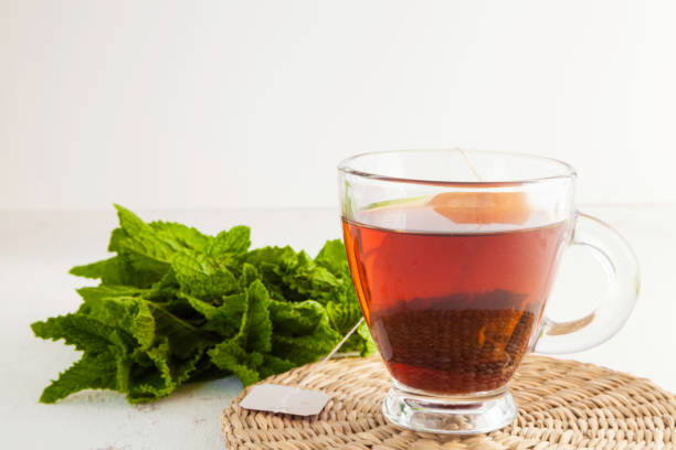 istock tea cup close-up and peppermint leaves 1226882847