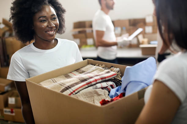 istock Volunteers carrying clothing 1226887624
