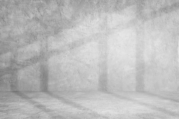 istock Plaster cement concrete wall texture background with shading for interior design and product showing. 1226889565