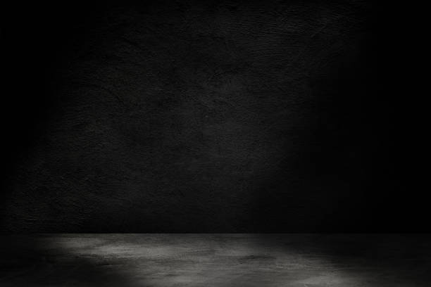 istock Studio dark room concrete floor grunge texture background with light shading. 1226889590