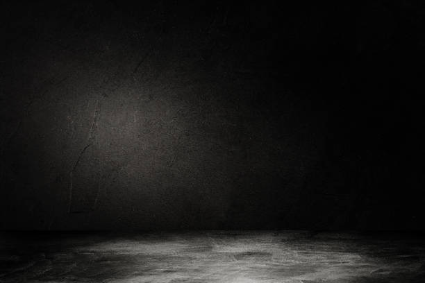 istock Studio dark room concrete floor grunge texture background with light shading. 1226889616