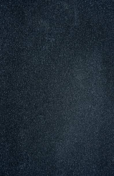 istock Black Rough Texture Background and Wallpaper with Copy Space in Vertical Orientation 1226890792
