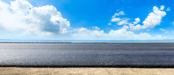 istock Asphalt road and lake with sky cloud landscape. 1226891267