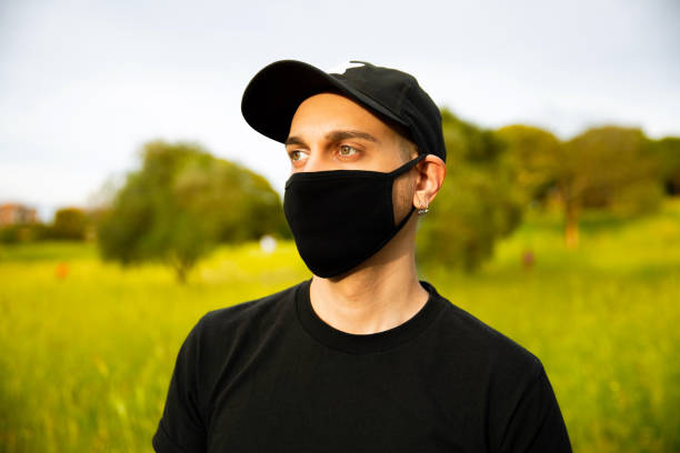 istock Young Men With Mask Outdoors 1226891284