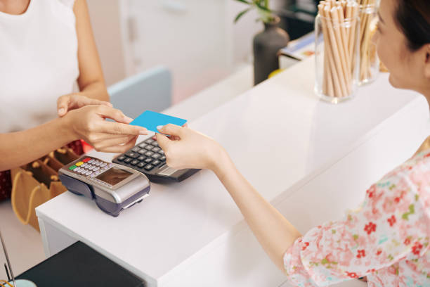 istock Woman paying for coffee 1226891627