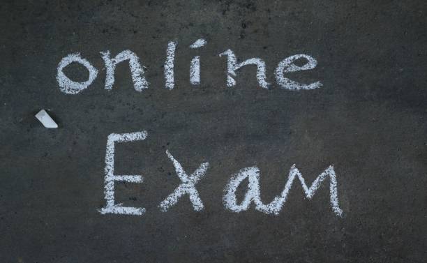 istock Online Exam Written on Black Surface with White Chalk, Educational Conceptual Photo 1226893914