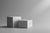 Stone showcase or rock podium stand on gray background with marble and spotlight concept. Pedestal of product display for design. 3D rendering.
