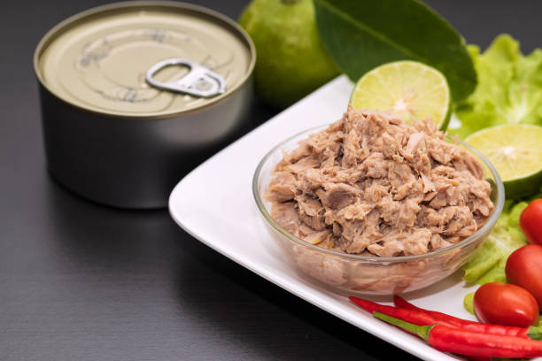 istock Tuna chunks in glass bowl with fresh vegetables salad. 1226895758
