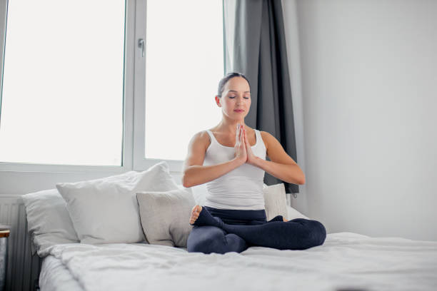 istock mindful caucasian lady in lotus pose 1226898228
