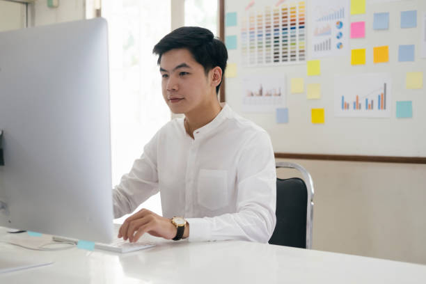 istock Young businessman analyze online marketing in his computer 1226899113