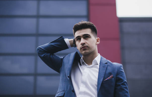istock stylish businessman posing in suit 1226900858