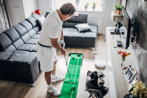 istock Man playing mini golf at home 1226903602