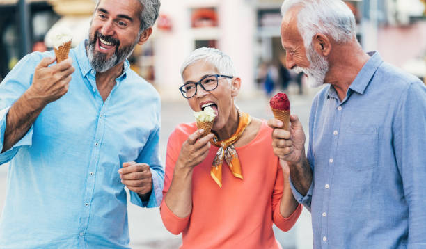 istock Happy senior friends eating ice cream 1226910704