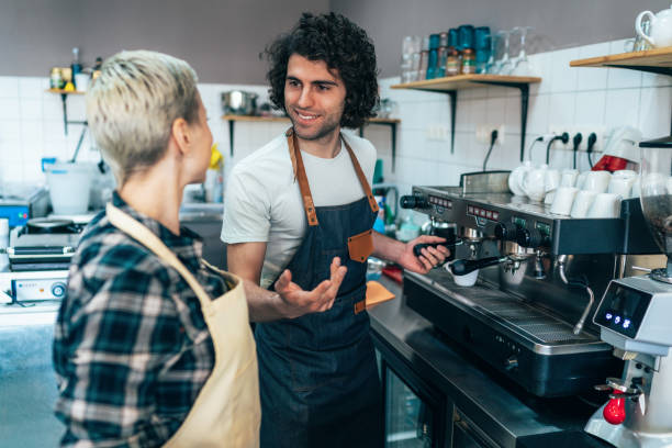 istock Male barista making coffee 1226910709