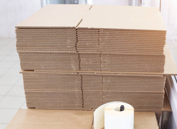 istock A stack of cardboard sheets for packing boxes in production. Pulp, waste paper, structure, carton 1226914385