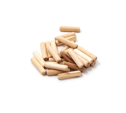 wooden dowel for assembling furniture on a white background, isolate