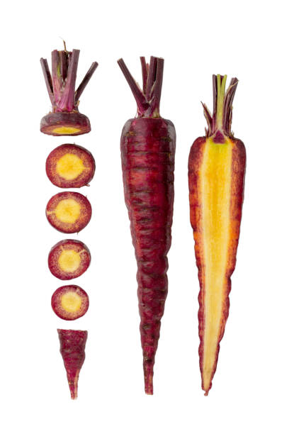 istock Whole and sliced red carrots isolated on white. 1226914534