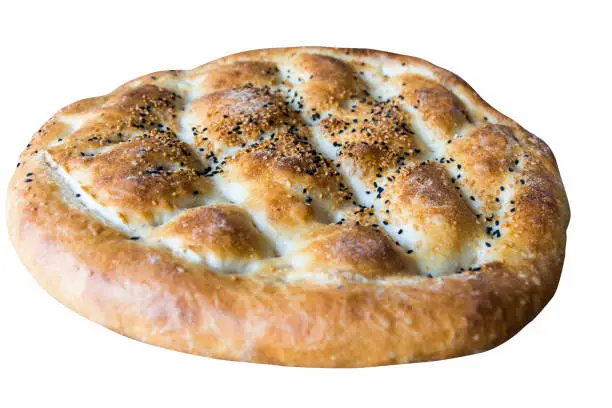Ramadan Pita (Ramazan Pidesi) Traditional Turkish bread for holy month Ramadan isolated on white background.