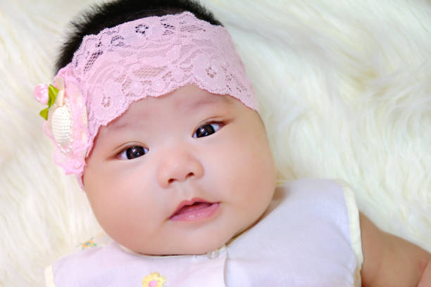 istock Cute newborn baby on white fabric background. 1226916529