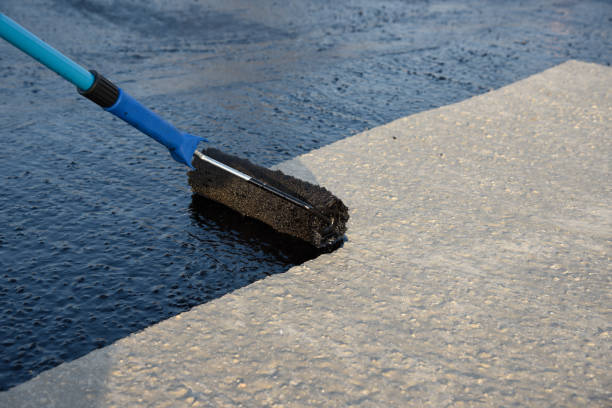 istock Worker applies bitumen mastic on the foundation 1226918189