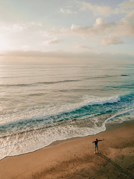 istock Woman standing on the beach 1226918922