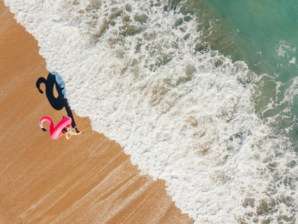 istock Happy woman relaxing on the beach 1226921445